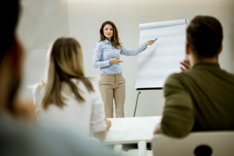 Creative positive female leader talking about business plan with